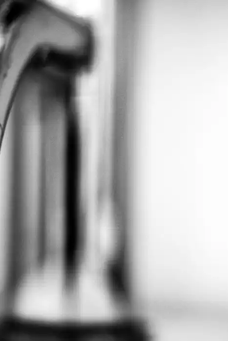 A close-up shows clear water running from a stainless-steel faucet.
